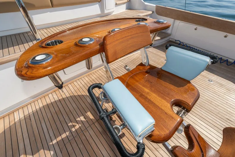 Zatara Yacht Photos Pics Luxury fishing chair on 2025 Viking 90 Convertible yacht, featuring teak deck and rod holders.