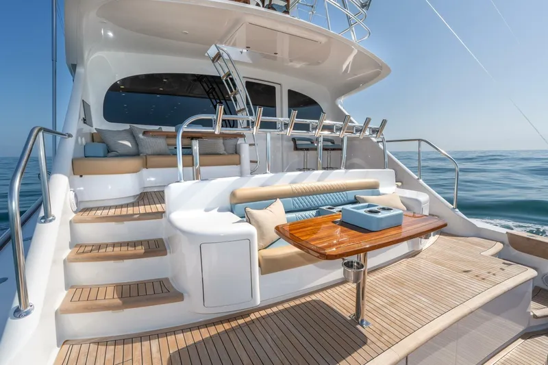 Zatara Yacht Photos Pics Luxurious 2025 Viking 90 Convertible yacht deck with elegant seating and ocean view.
