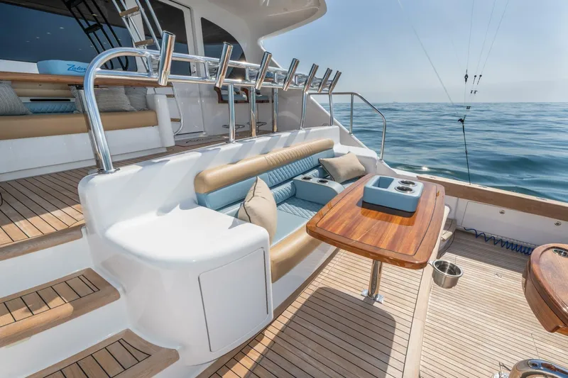 Zatara Yacht Photos Pics Luxurious 2025 Viking 90 Convertible yacht deck with seating and ocean view.