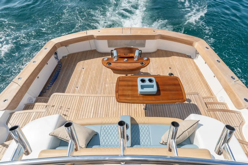 Zatara Yacht Photos Pics Luxurious deck of 2025 Viking 90 Convertible yacht cruising on open sea.