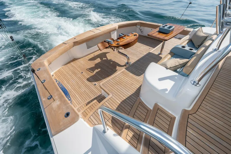 Zatara Yacht Photos Pics Luxurious 2025 Viking 90 Convertible yacht deck with seating and ocean view.