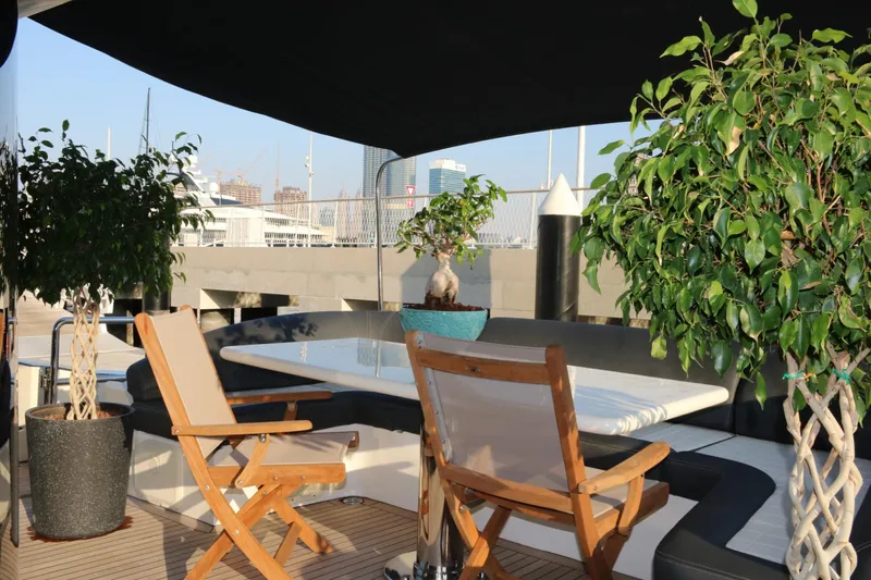 Simona Yacht Photos Pics Luxurious Azimut 98 Leonardo yacht deck with seating, table, and potted plants, 2003 model.