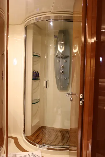 Simona Yacht Photos Pics Luxurious shower cabin on 2003 Azimut 98 Leonardo yacht with glass door and modern fixtures.