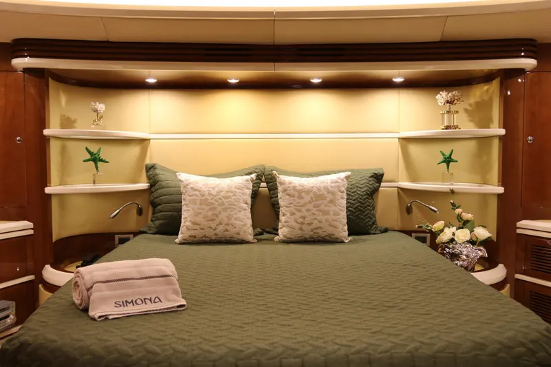 Simona Yacht Photos Pics Luxurious bedroom interior of 2003 Azimut 98 Leonardo yacht with elegant decor and plush bedding.