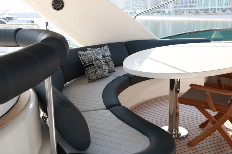 Simona Yacht Photos Pics Luxurious seating area on 2003 Azimut 98 Leonardo yacht with elegant cushions and table.
