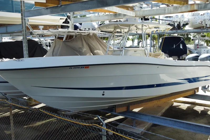  Yacht Photos Pics 2008 Hydra-Sports Vector 2900 CC boat in storage, featuring sleek white and blue design.