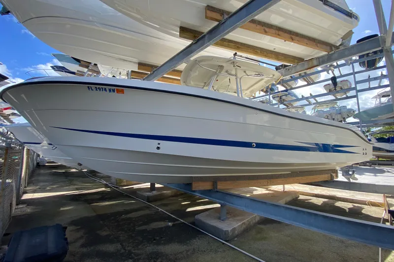  Yacht Photos Pics 2008 Hydra-Sports Vector 2900 CC boat on dry dock, showcasing sleek design and blue accents.