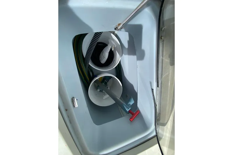  Yacht Photos Pics Storage compartment of 2008 Hydra-Sports Vector 2900 CC boat with hoses and cleaning supplies.