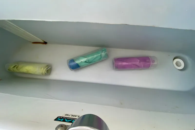  Yacht Photos Pics Storage compartment on 2008 Hydra-Sports Vector 2900 CC with colorful items inside.