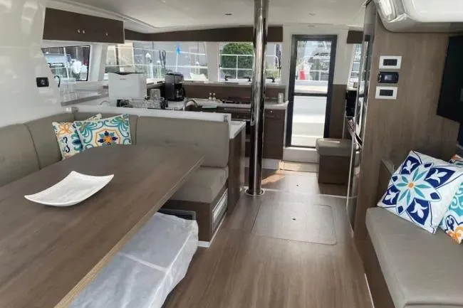 Nauti Habit Yacht Photos Pics Interior of 2023 Bali 4.2 yacht with modern furnishings and decorative pillows.