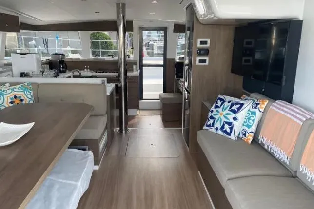 Nauti Habit Yacht Photos Pics Luxurious interior of 2023 Bali 4.2 yacht with modern furnishings and vibrant cushions.