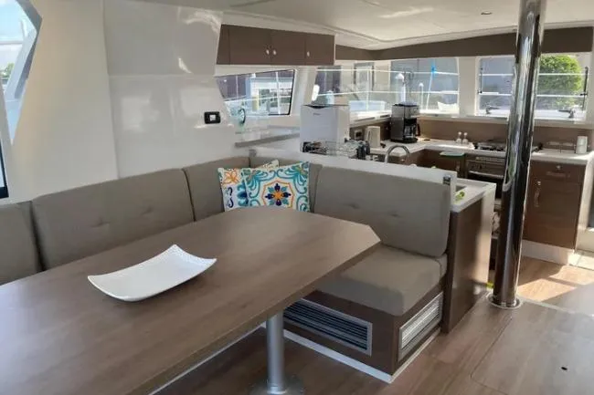 Nauti Habit Yacht Photos Pics Modern interior of 2023 Bali 4.2 yacht with kitchen and dining area.