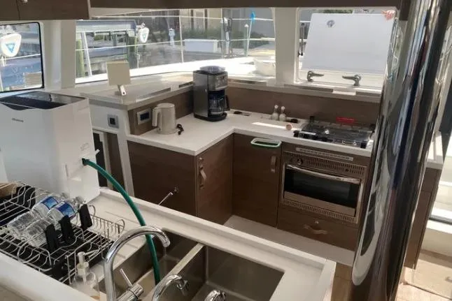 Nauti Habit Yacht Photos Pics Modern kitchen in 2023 Bali 4.2 yacht with appliances and sleek design.