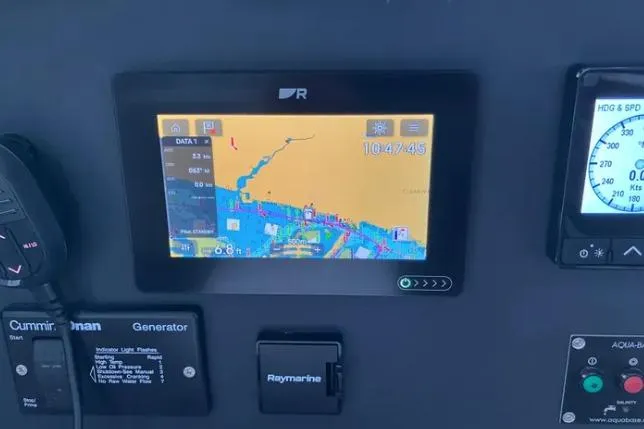 Nauti Habit Yacht Photos Pics Navigation system on a 2023 Bali 4.2 yacht dashboard with Raymarine display.