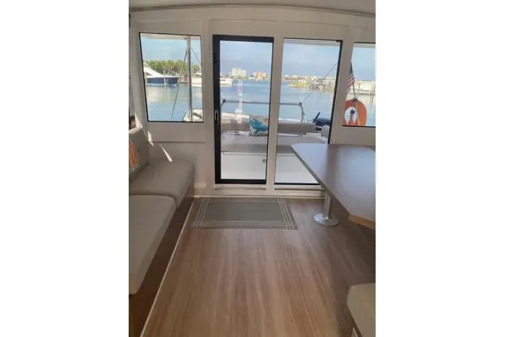 Nauti Habit Yacht Photos Pics Interior view of 2023 Bali 4.2 yacht with waterfront scenery.