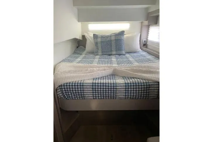 Nauti Habit Yacht Photos Pics Cozy bedroom in 2023 Bali 4.2 yacht with checkered bedding.