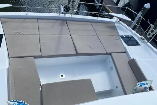 Nauti Habit Yacht Photos Pics Luxurious Bali 4.2 yacht deck with cushioned seating, 2023 model.
