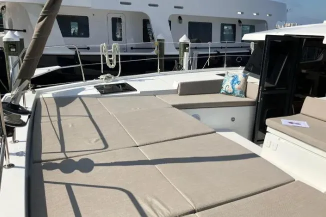 Nauti Habit Yacht Photos Pics Luxurious 2023 Bali 4.2 yacht deck with sunbathing area and seating.
