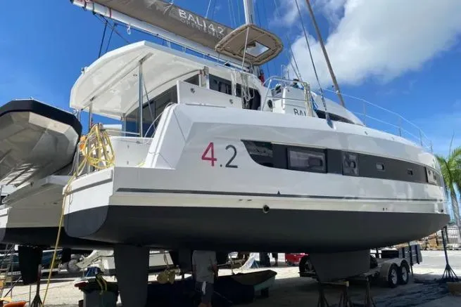 Nauti Habit Yacht Photos Pics 2023 Bali 4.2 catamaran on land, showcasing sleek design and modern features.