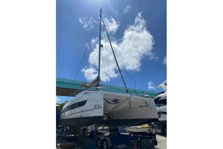Nauti Habit Yacht Photos Pics 2023 Bali 4.2 catamaran on trailer under clear blue sky.