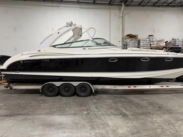 Prime Time Yacht Photos Pics 2005 Formula 370 Super Sport boat in warehouse on trailer.