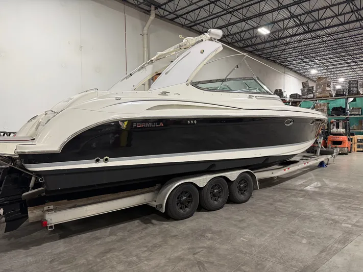Prime Time Yacht Photos Pics 2005 Formula 370 Super Sport boat in warehouse on trailer.