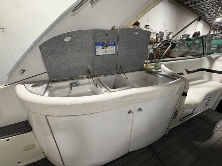 Prime Time Yacht Photos Pics 2005 Formula 370 Super Sport boat kitchen with sink and storage.