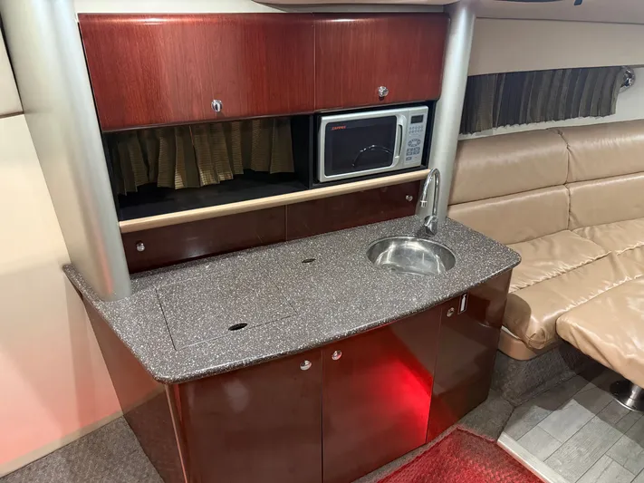 Prime Time Yacht Photos Pics 2005 Formula 370 Super Sport interior with kitchenette and seating area.