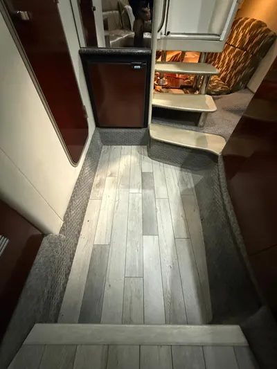 Prime Time Yacht Photos Pics Interior of a 2005 Formula 370 Super Sport yacht with wood flooring.