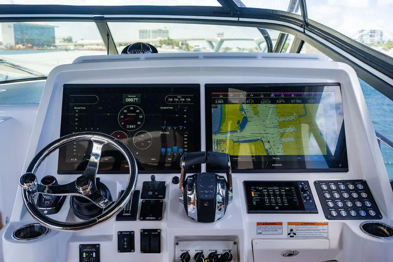  Yacht Photos Pics Intrepid 477 Evolution 2021 helm with advanced navigation displays and controls.