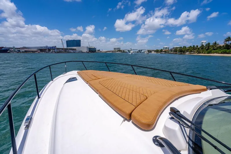  Yacht Photos Pics Intrepid 477 Evolution 2021 yacht with sun pad, cruising on a sunny day.