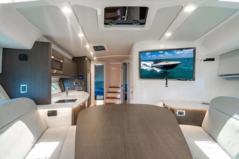  Yacht Photos Pics Luxurious interior of 2021 Intrepid 477 Evolution yacht with modern amenities and sleek design.