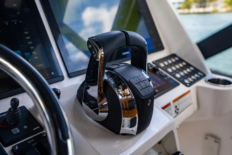  Yacht Photos Pics Control panel of 2021 Intrepid 477 Evolution boat with modern throttle and displays.