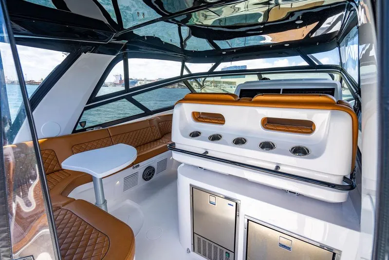  Yacht Photos Pics Luxurious interior of 2021 Intrepid 477 Evolution yacht with seating and modern amenities.