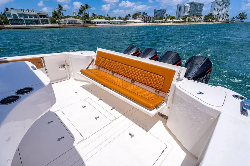  Yacht Photos Pics 2021 Intrepid 477 Evolution boat with tan seating, ocean view, and multiple outboard engines.