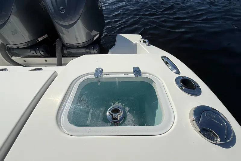  Yacht Photos Pics 2022 Pursuit S 288 Sport boat with dual engines and livewell on deck.