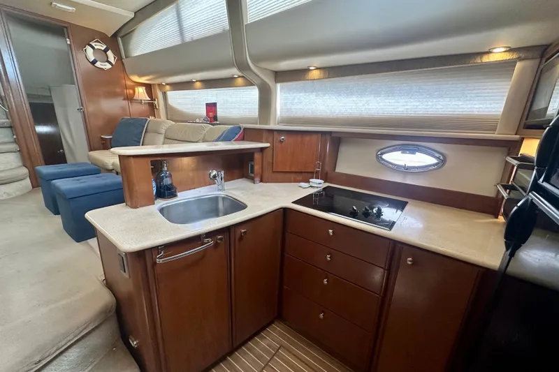  Yacht Photos Pics Luxurious interior of 2005 Meridian 459 Motoryacht with modern kitchen and seating area.