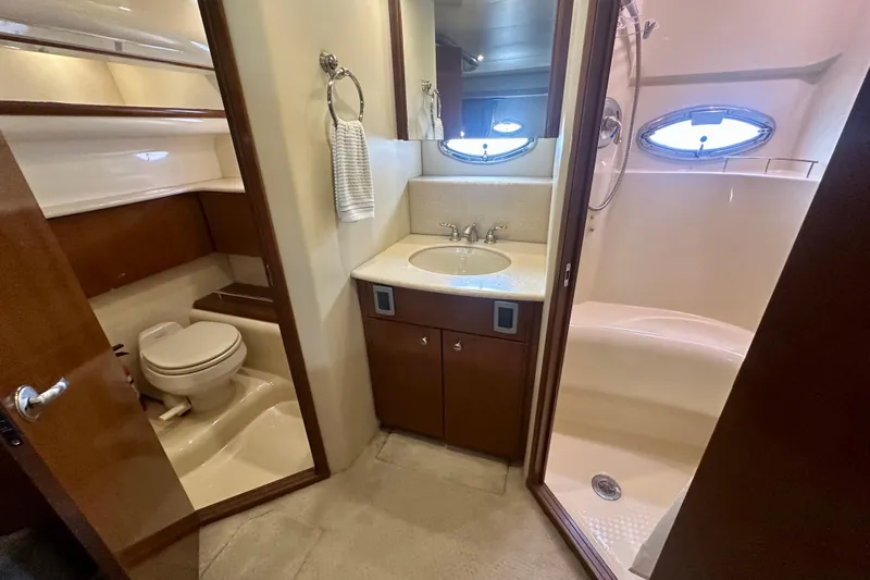  Yacht Photos Pics Luxurious bathroom in 2005 Meridian 459 Motoryacht with shower, sink, and toilet.