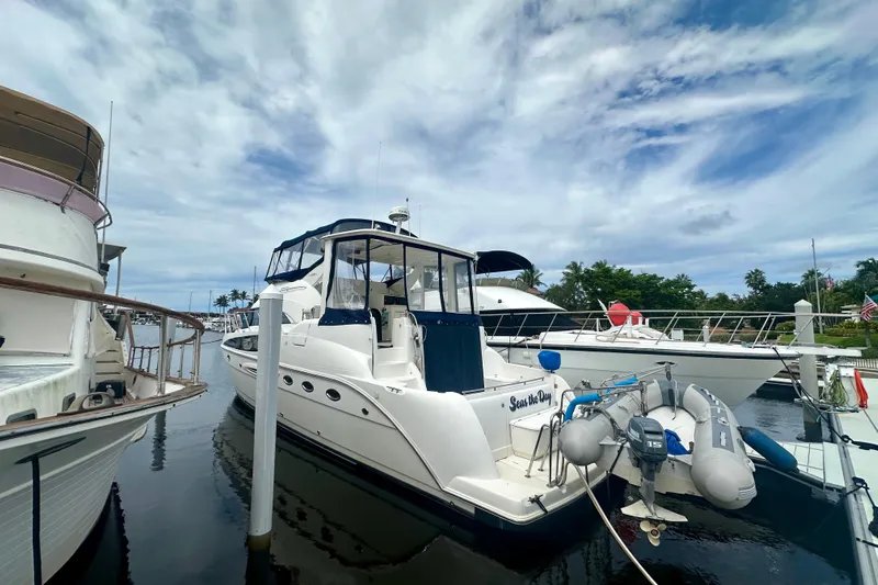  Yacht Photos Pics 2005 Meridian 459 Motoryacht docked at marina under cloudy sky.