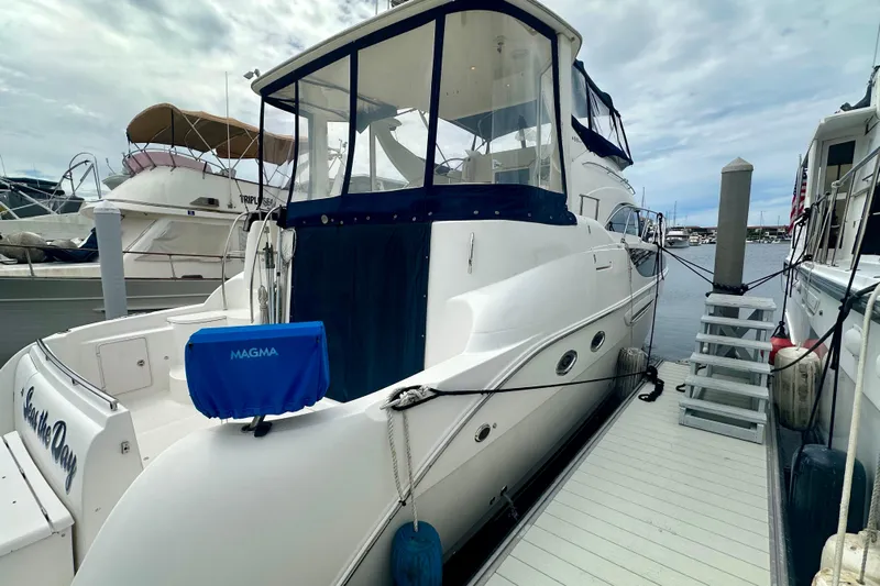  Yacht Photos Pics 2005 Meridian 459 Motoryacht docked at marina, featuring sleek design and spacious deck.