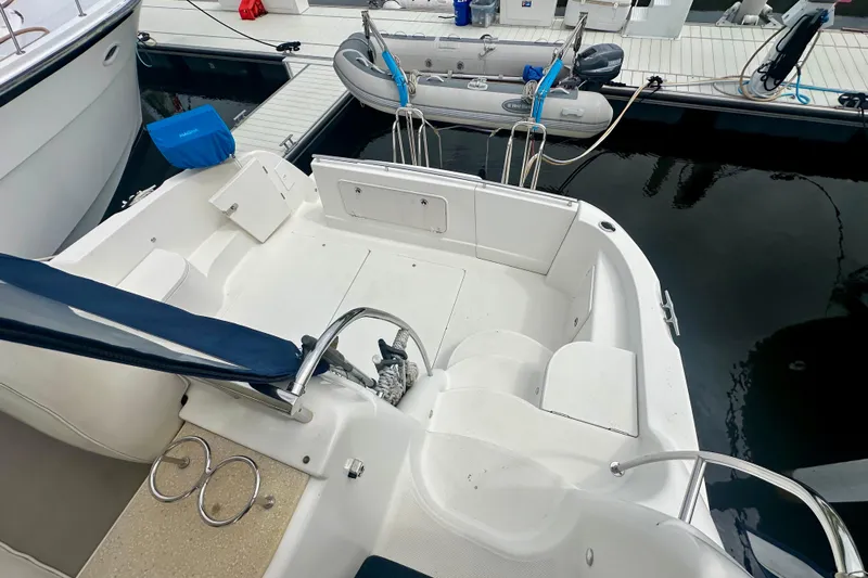  Yacht Photos Pics 2005 Meridian 459 Motoryacht docked, featuring spacious deck and tender boat.