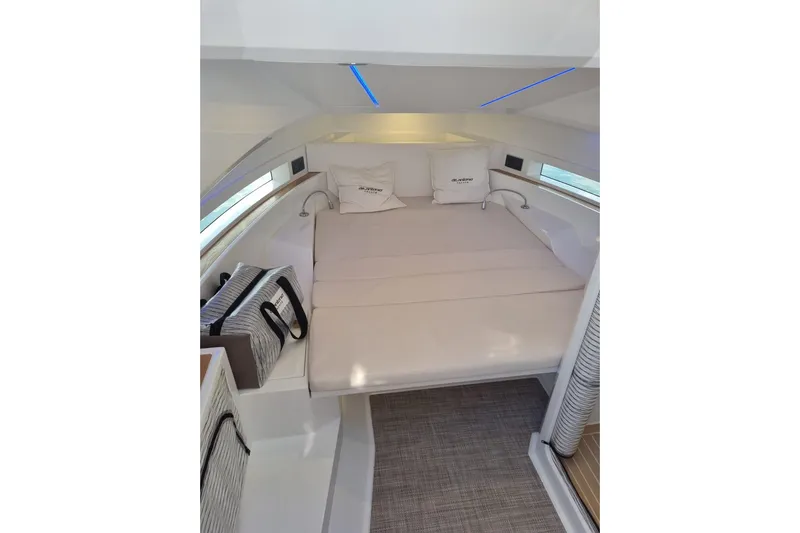  Yacht Photos Pics Luxurious interior cabin of 2024 DE ANTONIO D32 yacht with cozy bedding.