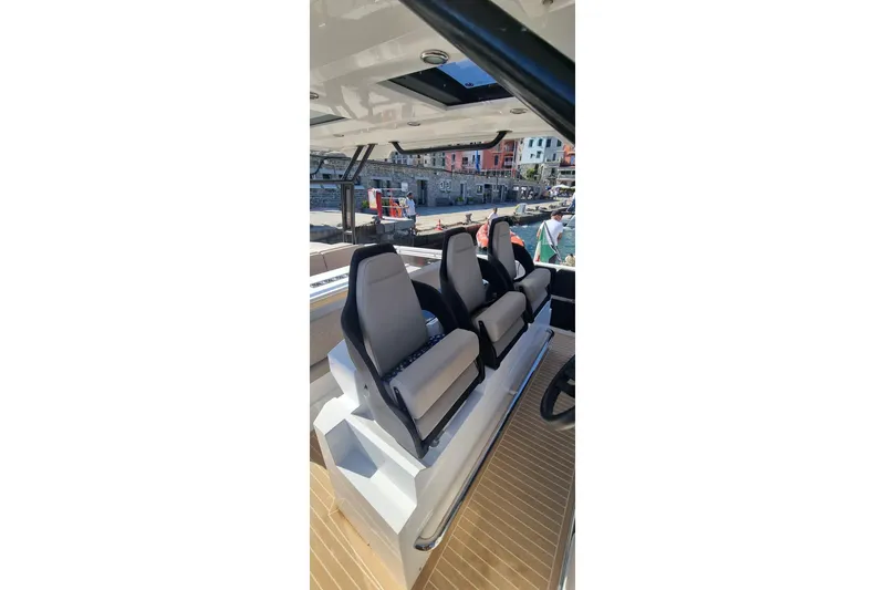  Yacht Photos Pics 2024 De Antonio Yachts D32 interior with modern seating and sleek design.