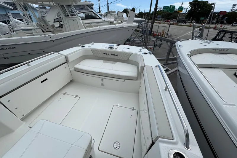 57562 235te Sf Yacht Photos Pics 2026 World Cat 235 TE boat interior with white seating and storage compartments.