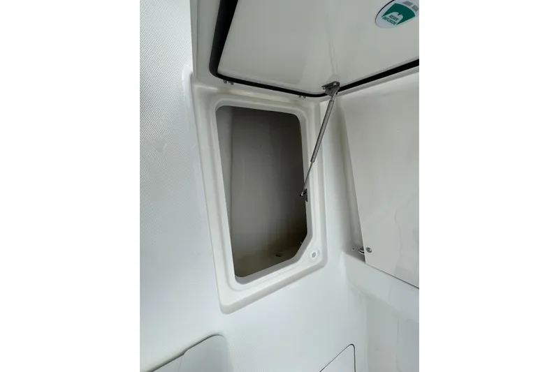 57562 235te Sf Yacht Photos Pics Open storage compartment on 2026 World Cat 235 TE boat interior.