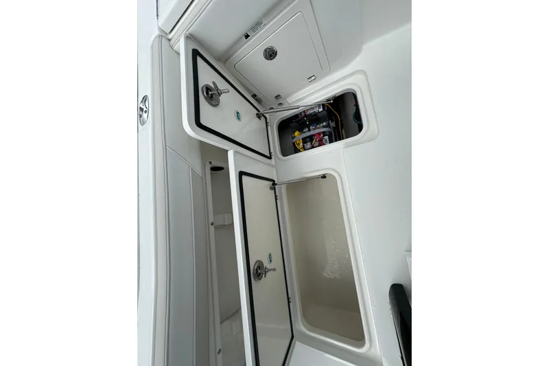 57562 235te Sf Yacht Photos Pics Open storage compartments on a 2026 World Cat 235 TE boat interior.
