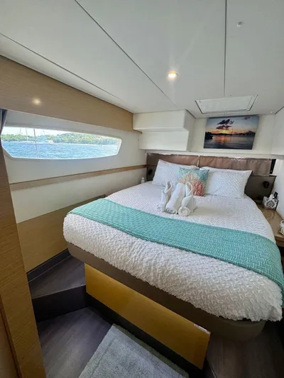  Yacht Photos Pics Luxurious cabin interior of 2015 Fountaine Pajot SABA 50 yacht with scenic window view.