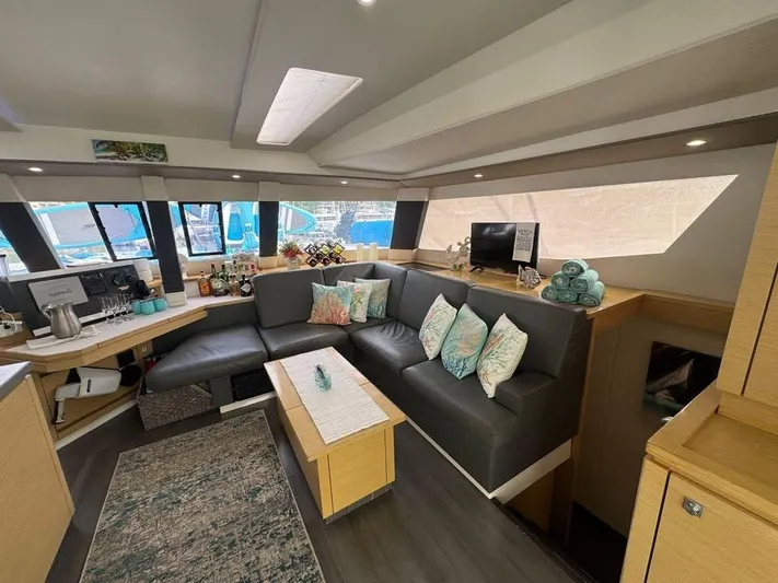  Yacht Photos Pics Luxurious interior of 2015 Fountaine Pajot SABA 50 catamaran with modern seating and decor.