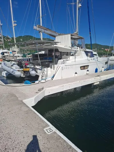 Yacht Photos Pics 2015 Fountaine Pajot SABA 50 catamaran docked at marina under clear blue sky.
