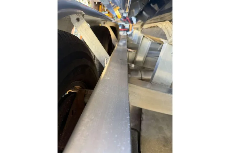  Yacht Photos Pics Close-up of a 2022 Contender 35 ST boat trailer, showcasing structural details.